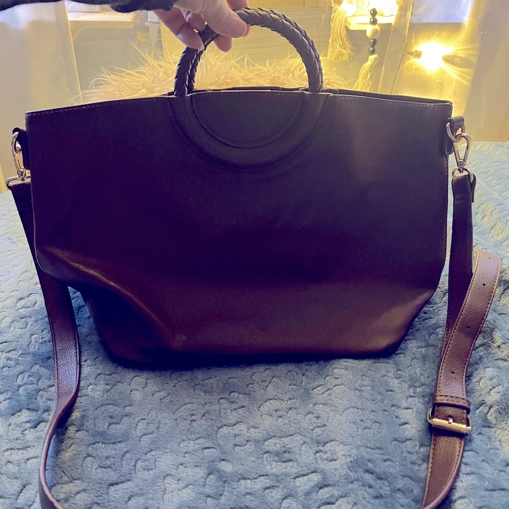 Brown leather tote with detachable crossbody strap.